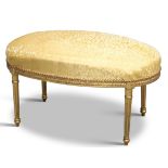 A LOUIS XV STYLE GILDED AND UPHOLSTERED OVAL STOOL