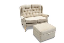 A CELEBRITY UPHOLSTERED TWO-SEATER HIGH-BACK SOFA AND STOOL