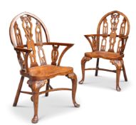 A PAIR OF GOTHIC STYLE STAINED BEECH WINDSOR ARMCHAIRS