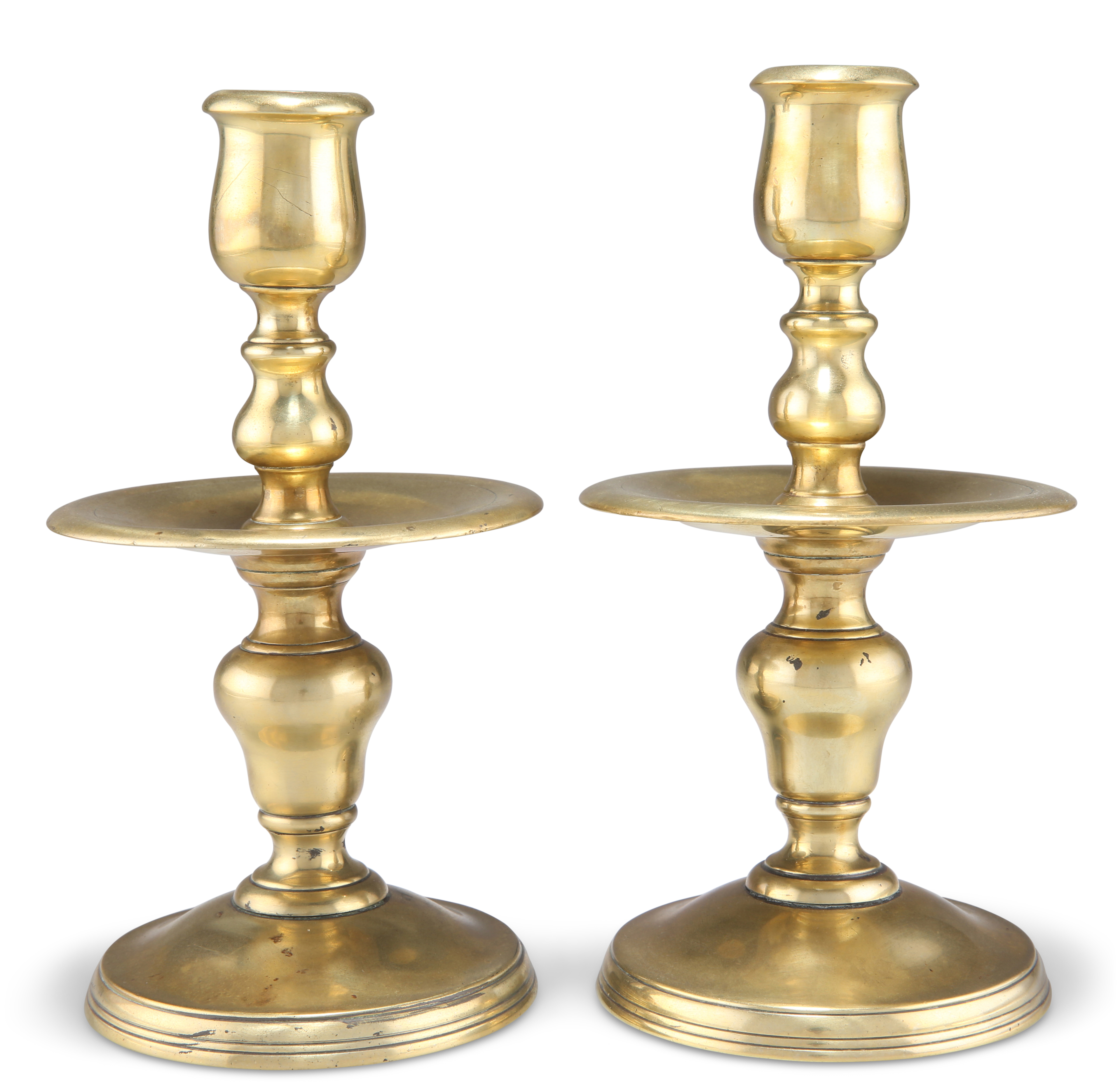 A PAIR OF HEEMSKIRK BRASS CANDLESTICKS