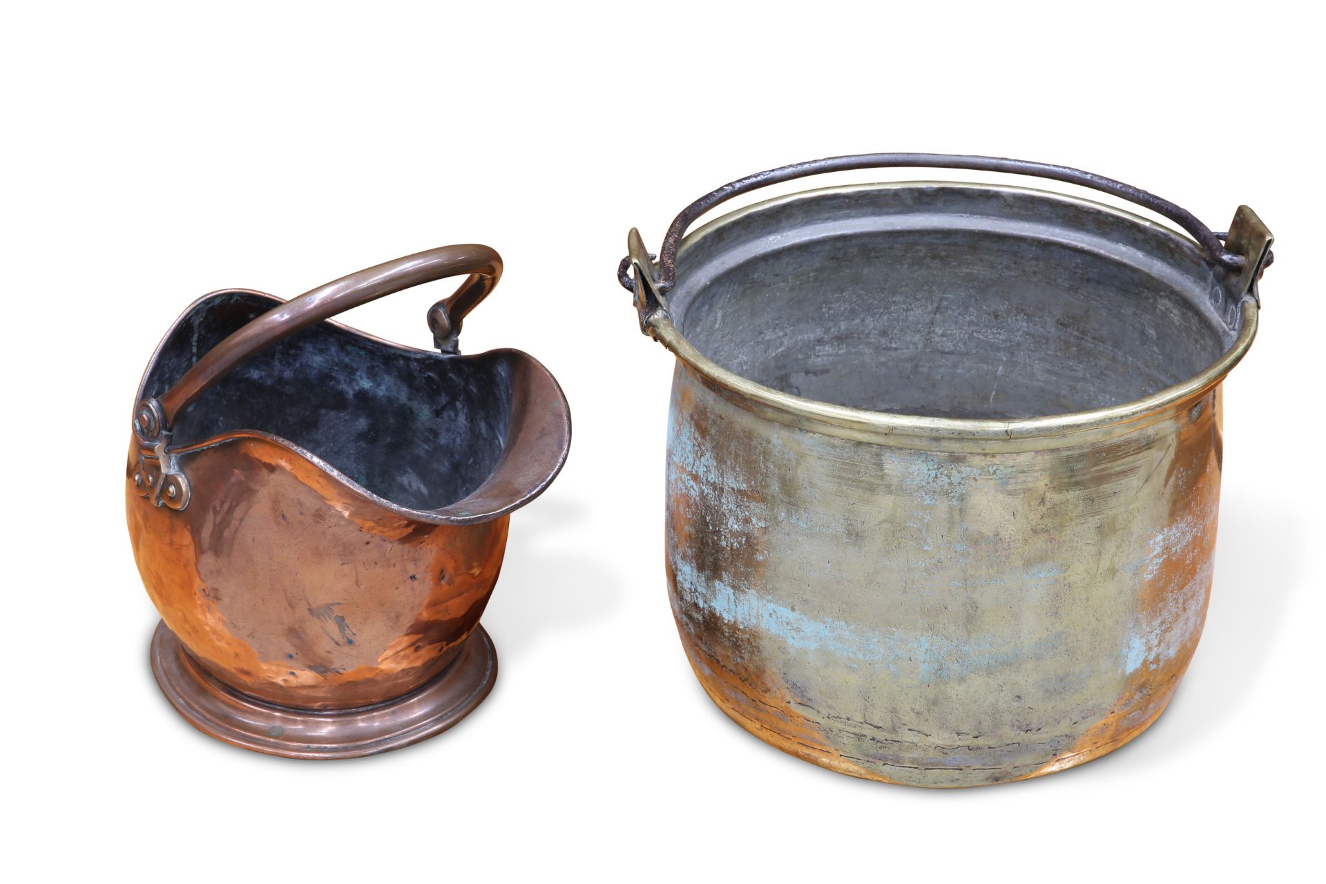 A LARGE BRASS SWING-HANDLED LOG BIN, AND A COPPER HELMET-SHAPED COAL SCUTTLE