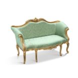 AN 18TH CENTURY STYLE GILDED AND UPHOLSTERED SETTEE