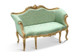 AN 18TH CENTURY STYLE GILDED AND UPHOLSTERED SETTEE
