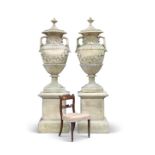 A PAIR OF EXCEPTIONALLY LARGE RECONSTITUTED STONE GARDEN URNS