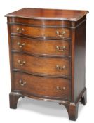 A GEORGE III STYLE MAHOGANY SERPENTINE BACHELOR’S CHEST, EARLY 20TH CENTURY
