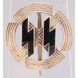 A GERMAN WAFFEN SS RUNIC AND SWASTIKA BREAST BADGE