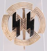 A GERMAN WAFFEN SS RUNIC AND SWASTIKA BREAST BADGE