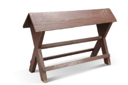 A COUNTRY HOUSE WOODEN SADDLE STAND