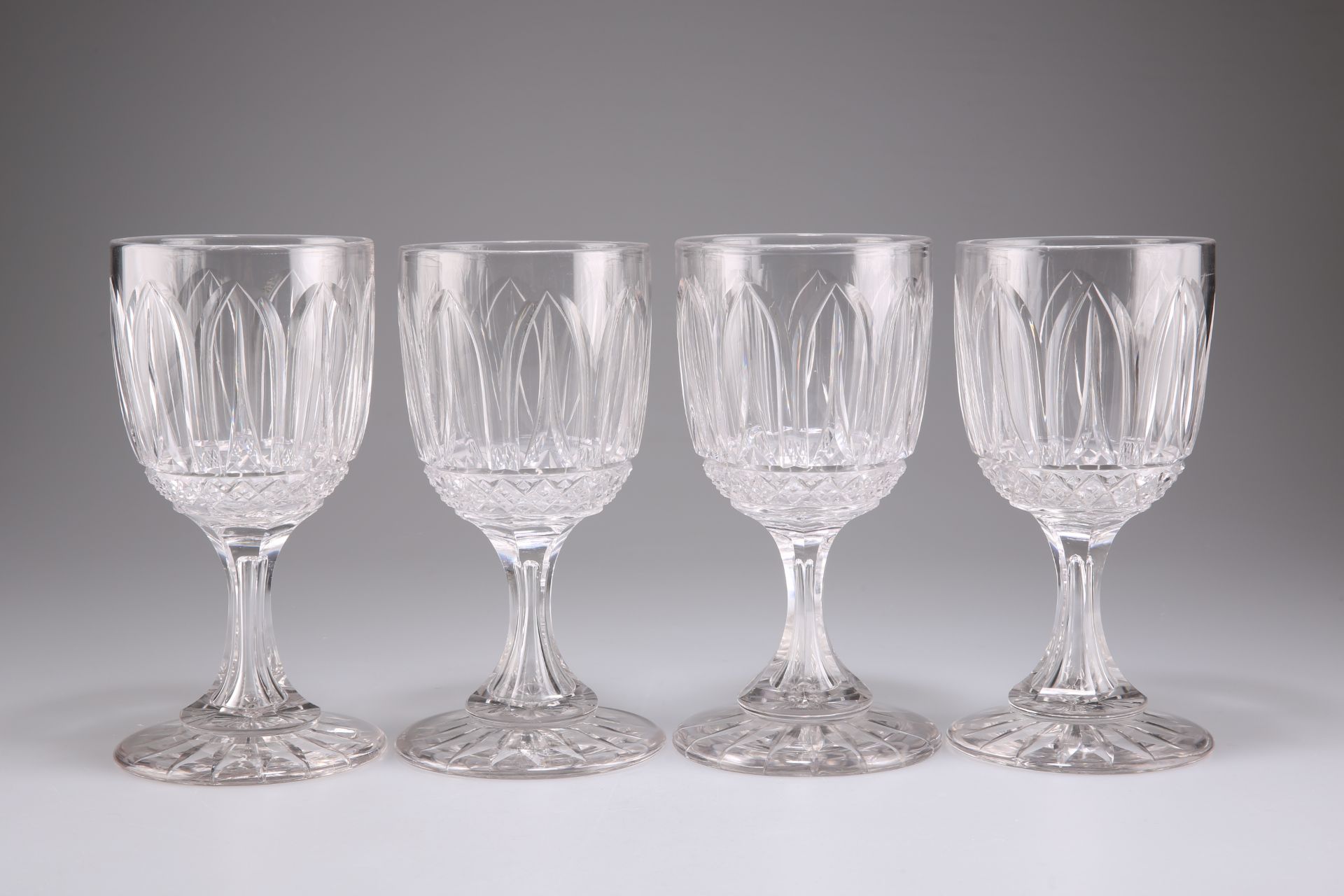 A SET OF FOUR VICTORIAN CUT GLASS WINE GLASSES