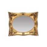 A LARGE PERIOD STYLE GILT FRAMED MIRROR