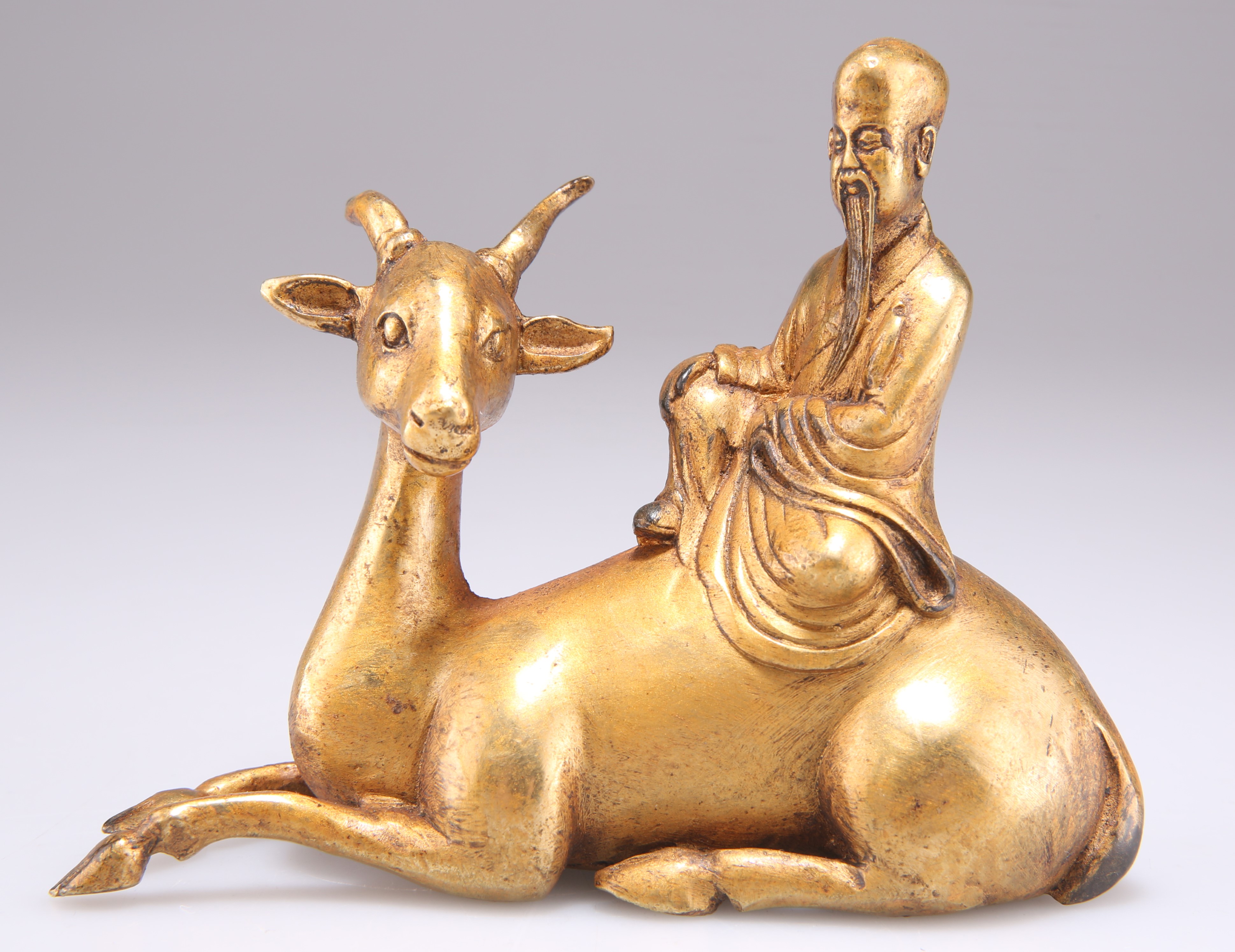 A CHINESE BRONZE FIGURE GROUP OF SHOULAO AND A DEER