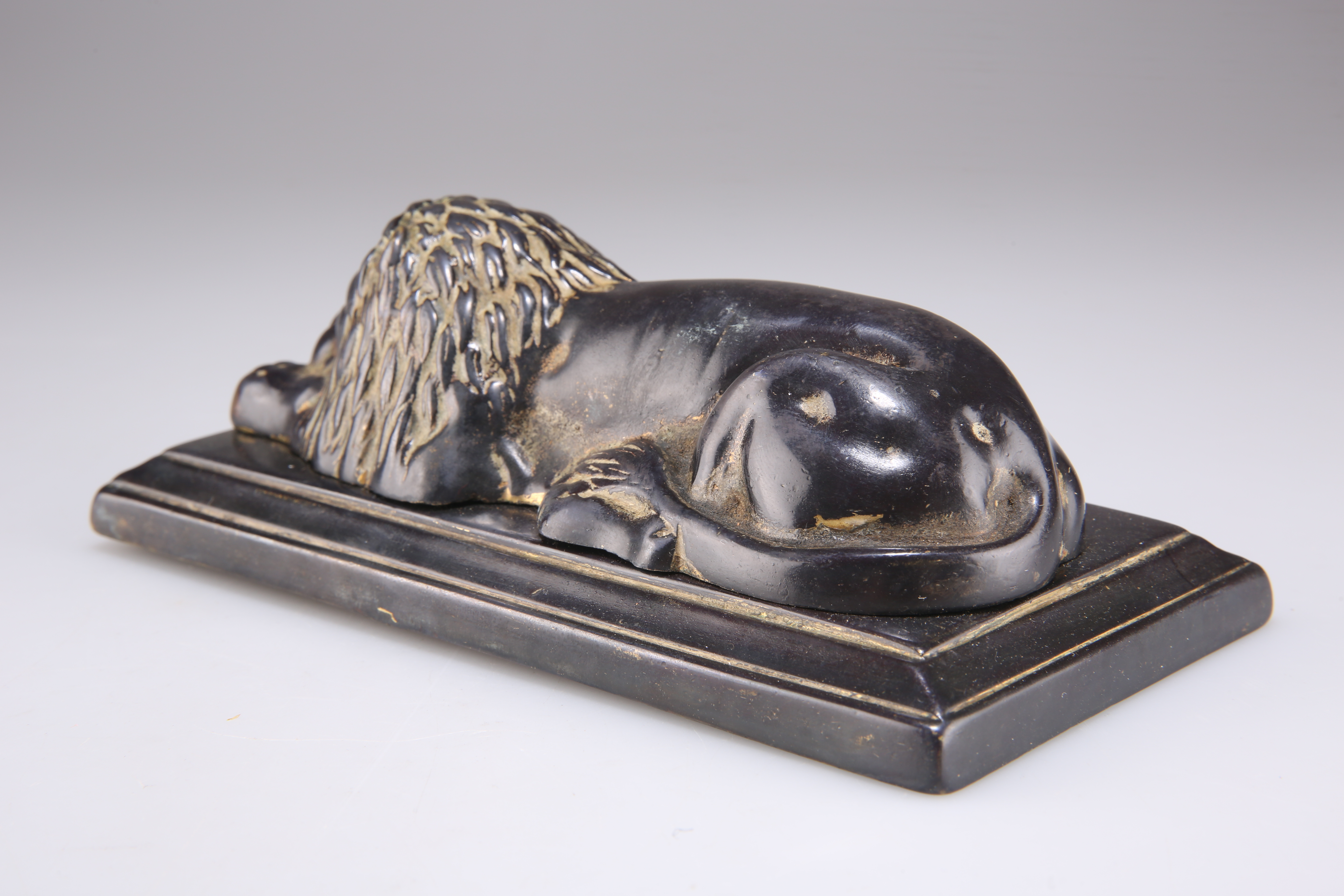 A 19TH CENTURY BRONZE OF A RECUMBENT LION - Image 2 of 2