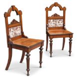 A PAIR OF VICTORIAN OAK HALL CHAIRS WITH MINTON TILES