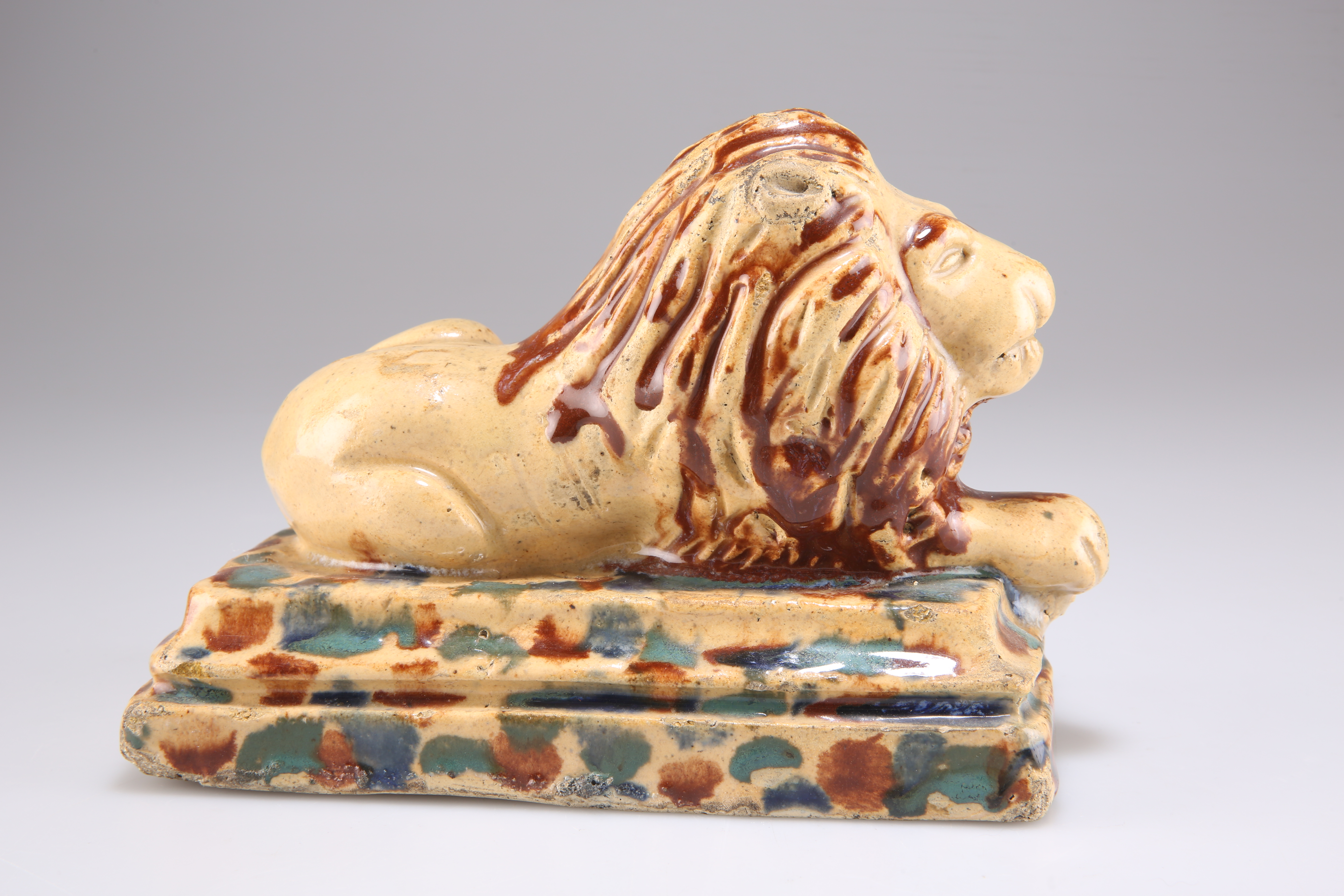 A 19TH CENTURY POTTERY MODEL OF A RECUMBENT LION - Image 2 of 2