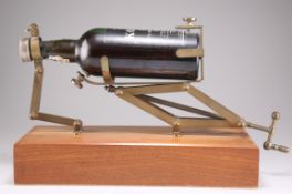 A BRASS DECANTING CRADLE