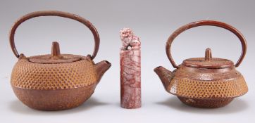 TWO JAPANESE CAST IRON MINIATURE TEAPOTS AND A CHINESE MARBLE SEAL