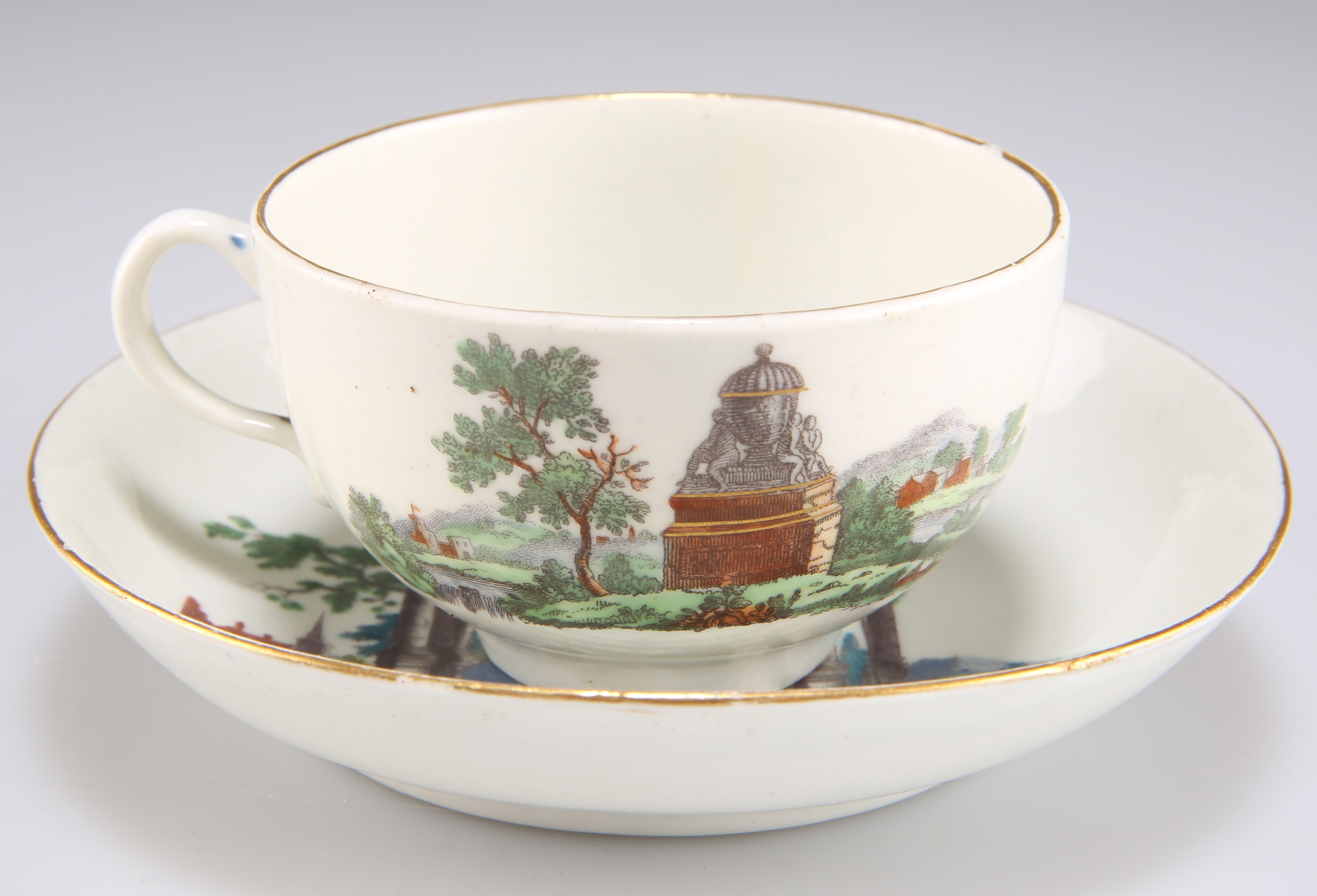 A WORCESTER PORCELAIN 'EUROPEAN RUINS' TEACUP AND SAUCER, CIRCA 1765