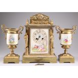 A GILT METAL AND PORCELAIN CLOCK GARNITURE, CIRCA 1890