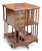 AN ART NOUVEAU MAHOGANY REVOLVING BOOKCASE