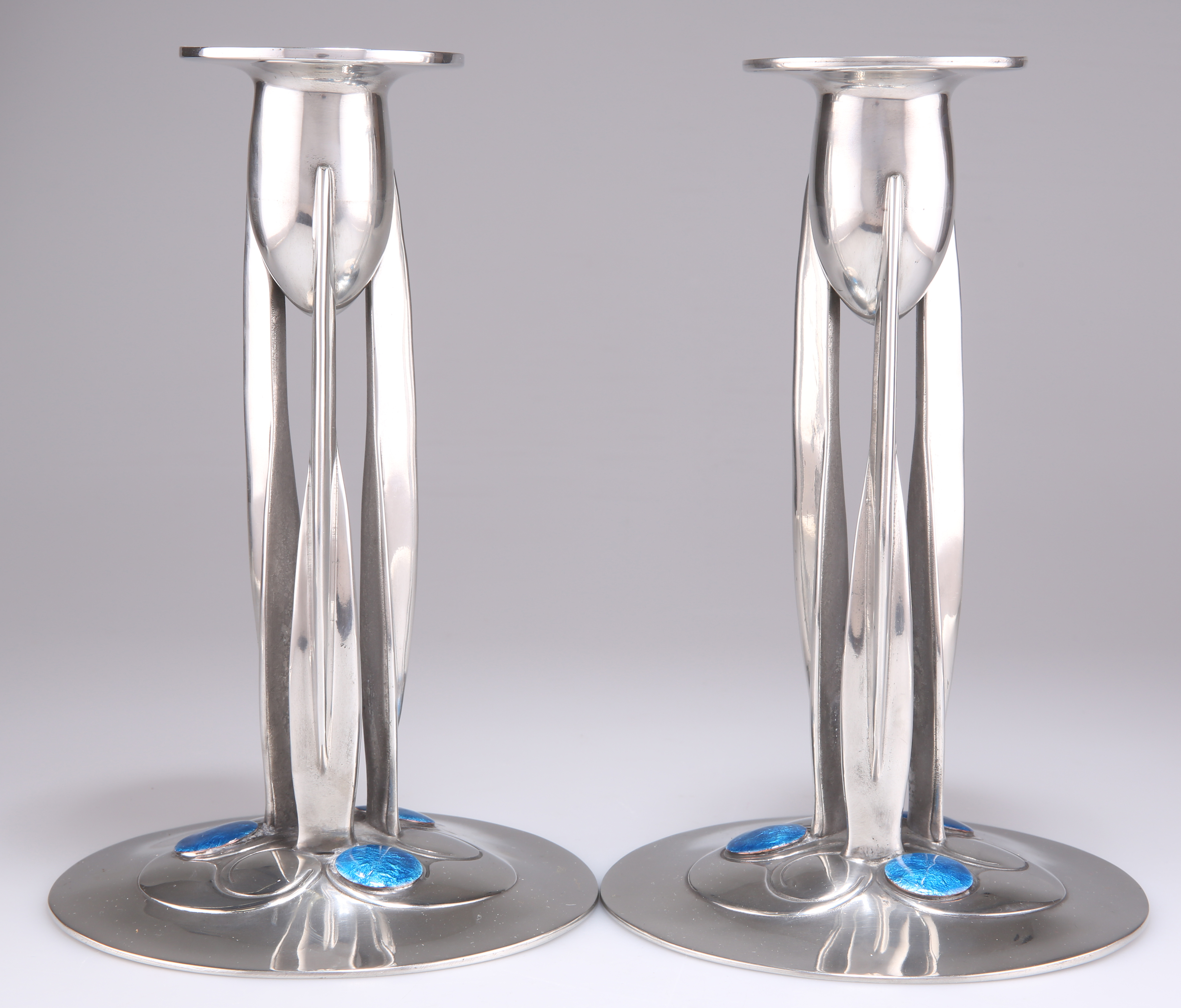 ARCHIBALD KNOX (1864-1933) FOR LIBERTY & CO, A PAIR OF TUDRIC PEWTER CANDLESTICKS, NO.0223