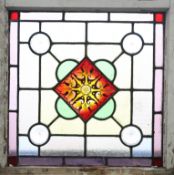 A LEADED STAINED GLASS WINDOW