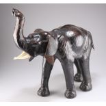 AN EARLY 20TH CENTURY LEATHER MODEL OF AN ELEPHANT