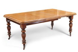 A VICTORIAN MAHOGANY EXTENDING DINING TABLE