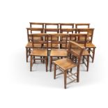 A GROUP OF TWELVE BEECH AND OAK CHAPEL CHAIRS, LATE 19TH/EARLY 20TH CENTURY