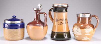 A ROYAL DOULTON STONEWARE SILVER-RIMMED PITCHER AND THREE FURTHER SILVER-MOUNTED DOULTON PIECES