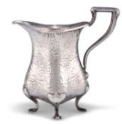 AN ARTS AND CRAFTS SILVER CREAM JUG