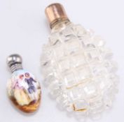 A VICTORIAN CUT-GLASS SCENT FLASK AND A SILVER-TOPPED PORCELAIN SCENT FLASK