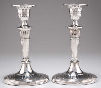 A PAIR OF LATE VICTORIAN SILVER CANDLESTICKS