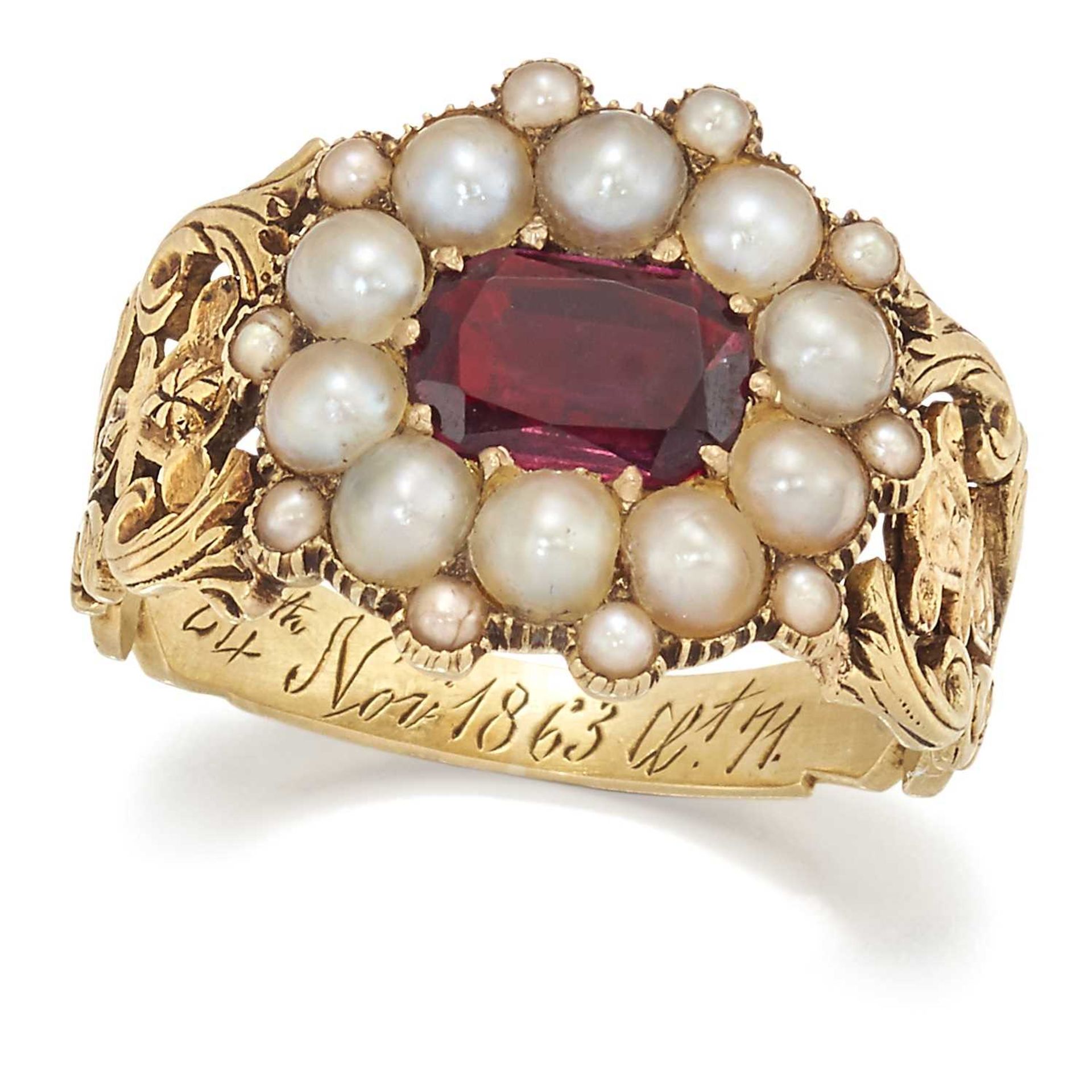 AN EARLY 19TH CENTURY GARNET AND SPLIT PEARL CLUSTER MOURNING RING
