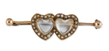 A LATE 19TH CENTURY MOONSTONE AND SEED PEARL TWIN HEART BROOCH