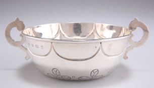 AN ARTS AND CRAFTS SILVER PORRINGER