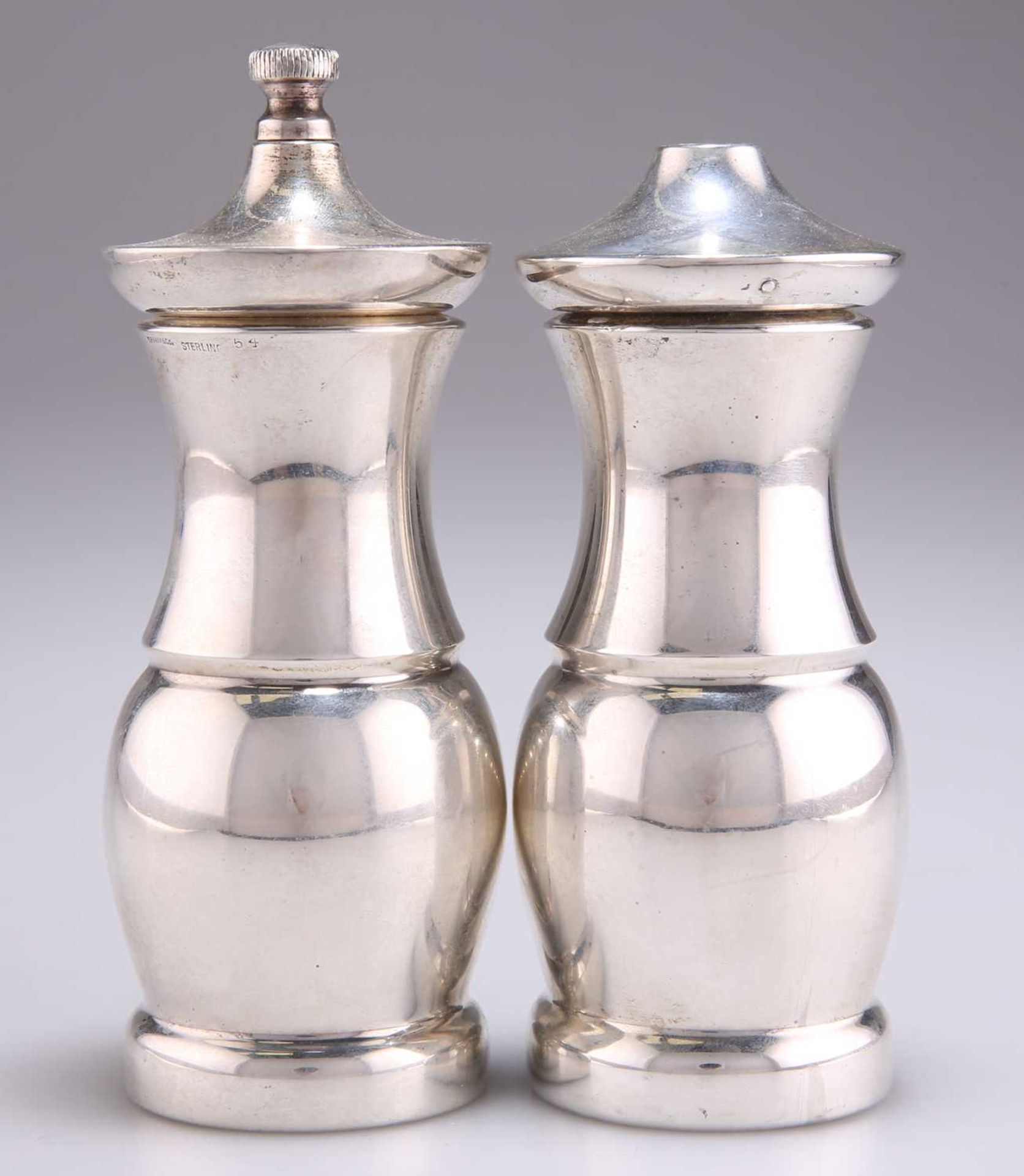 AN AMERICAN STERLING SILVER PEPPER MILL AND SALT SHAKER