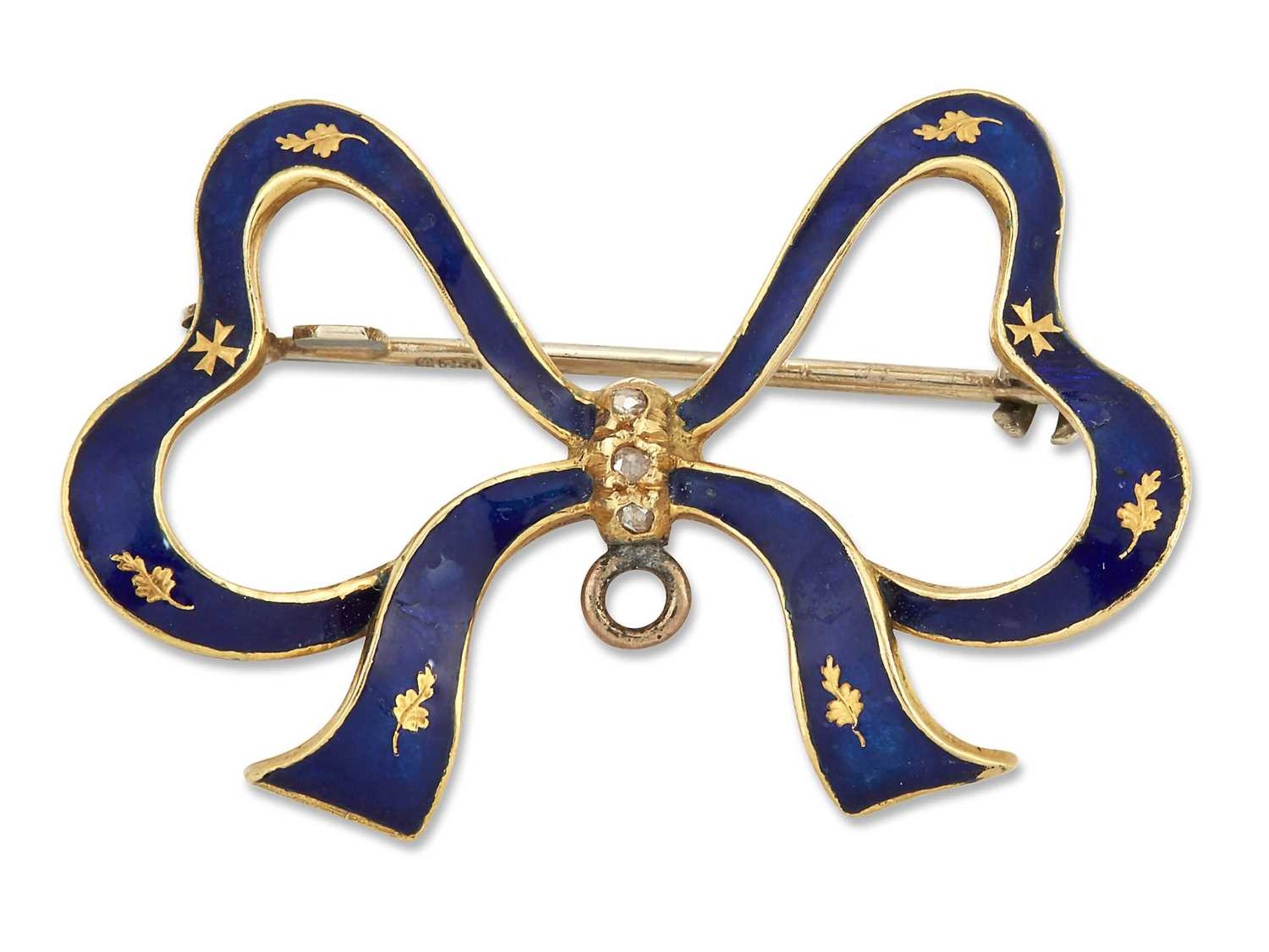 AN 18 CARAT GOLD ENAMEL AND DIAMOND BOW BROOCH