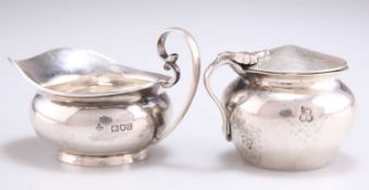 AN ARTS AND CRAFTS SILVER MUSTARD AND AN EDWARDIAN SILVER CREAM JUG
