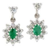 A PAIR OF 18 CARAT GOLD EMERALD AND DIAMOND CLUSTER EARRINGS