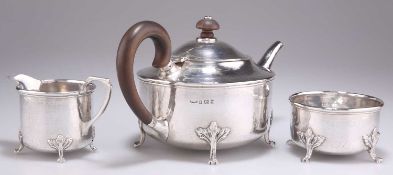 AN ARTS AND CRAFTS SILVER THREE-PIECE TEA SERVICE