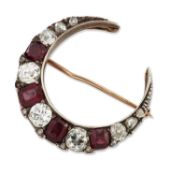 A MID 19TH CENTURY GARNET AND DIAMOND CRESCENT BROOCH