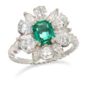 AN EMERALD AND DIAMOND CLUSTER RING