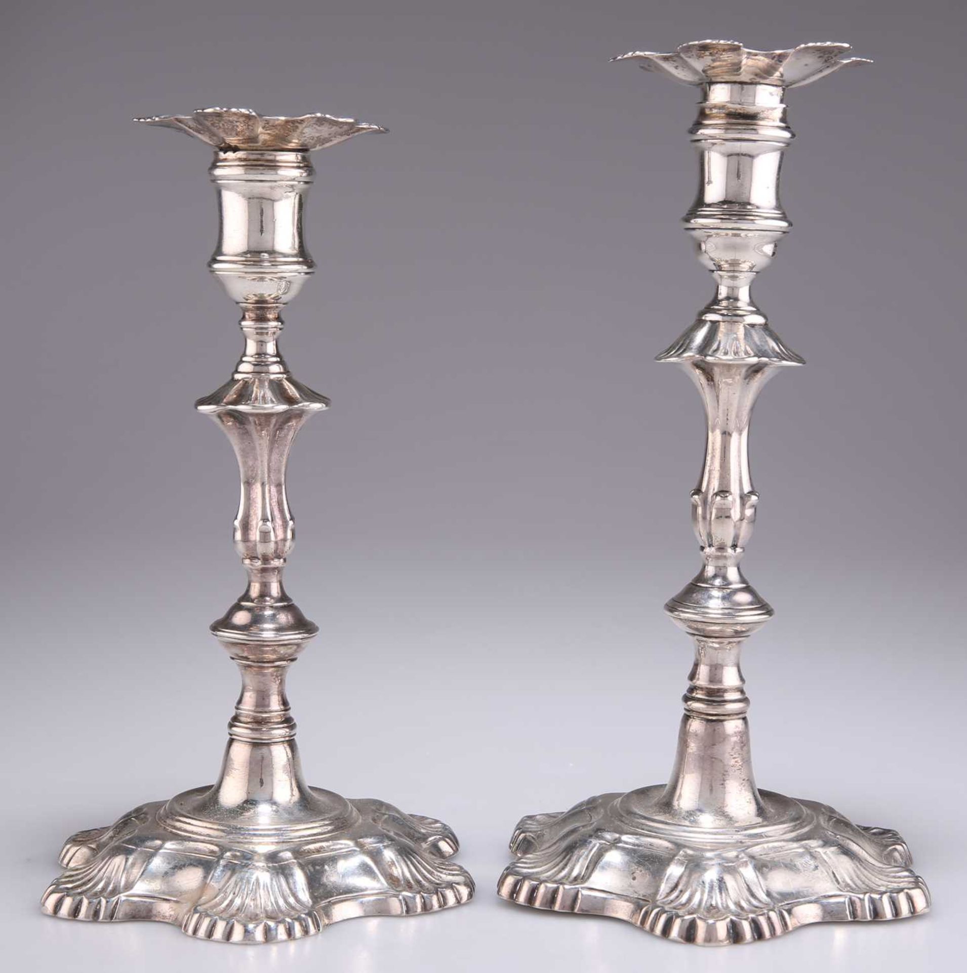 TWO 18TH CENTURY CAST SILVER CANDLESTICKS