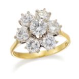 AN 18 CARAT GOLD DIAMOND CLUSTER RING