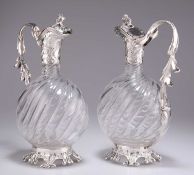 A FINE PAIR OF FRENCH SILVER-MOUNTED GLASS CLARET JUGS