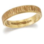 AN 18 CARAT GOLD TEXTURED BAND RING