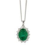 AN 18 CARAT WHITE GOLD EMERALD AND DIAMOND CLUSTER PENDANT ON CHAIN