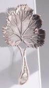 A GEORGE III SILVER CADDY SPOON