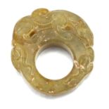 A CARVED JADE THUMB RING