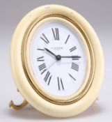 CARTIER: A GILT METAL AND ENAMEL TRAVEL ALARM CLOCK